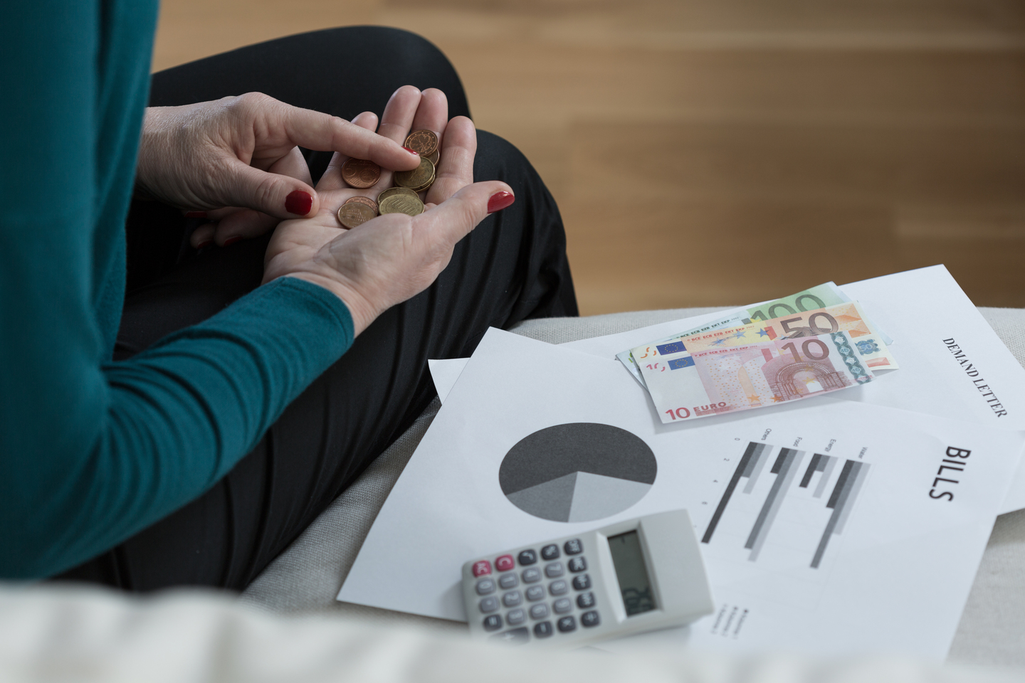 Close-up of penniless older woman counting her money